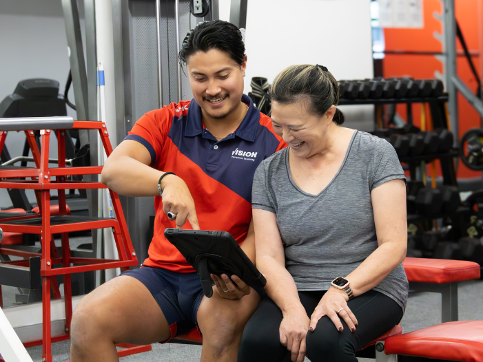 Client and trainer discussing training plan