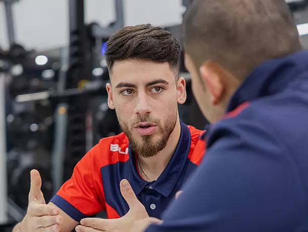 Male trainer with male trainer