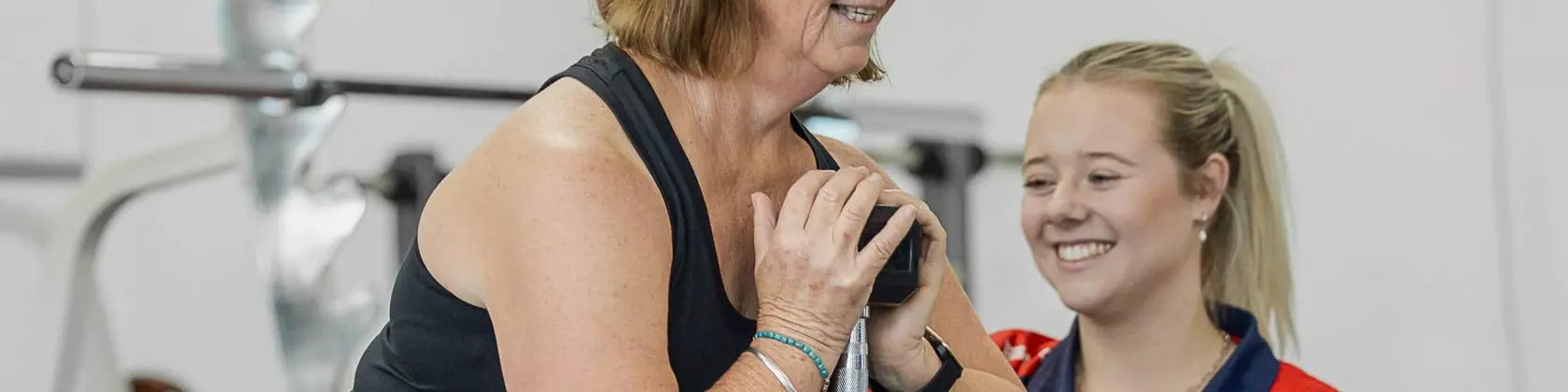 Trainer with client goblet squat 