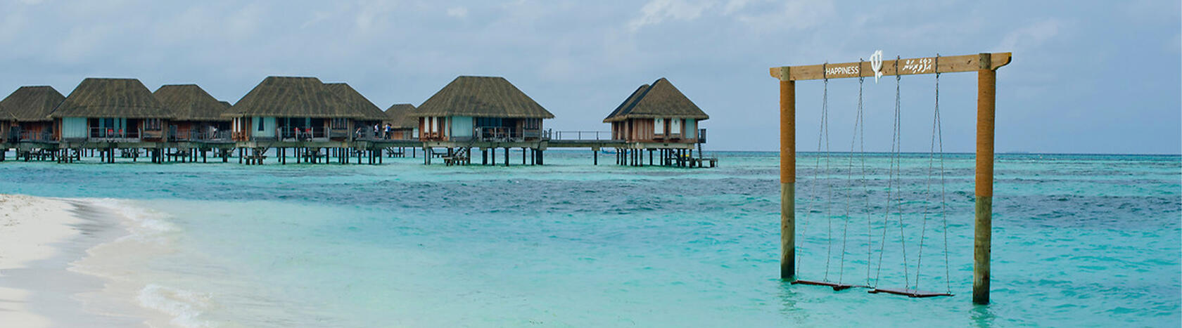 Swing and huts on water