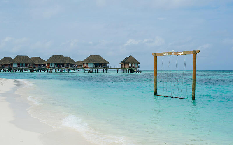 Swing and huts on water mobile