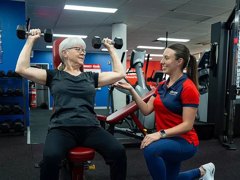 female shoulder press vision personal training 