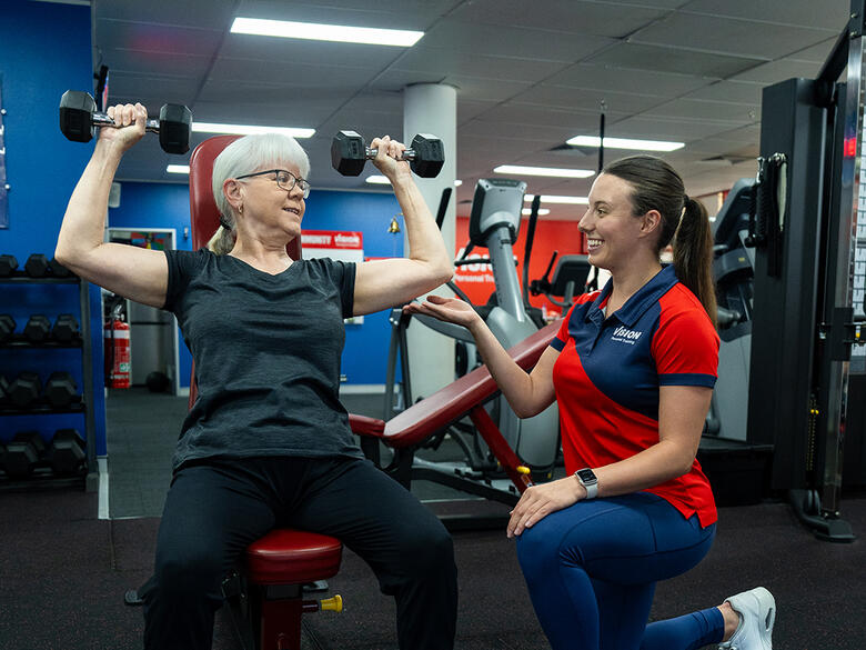 female shoulder press vision personal training 